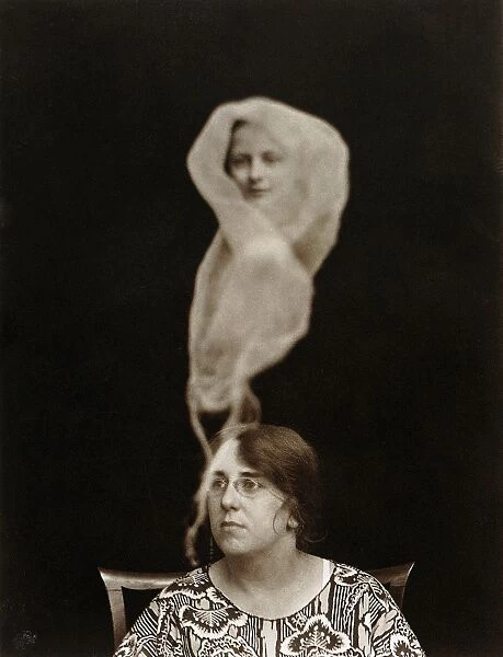 SPIRIT PHOTOGRAPH, 1921. Miss Evans with a spirit emanation. Photographed by English photographer Staveley Bulford, 1921