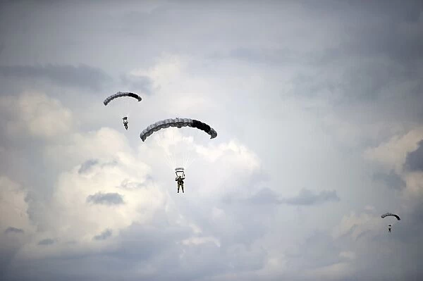 HALO jumpers descend to the ground after exiting a C-17 Globemaster III