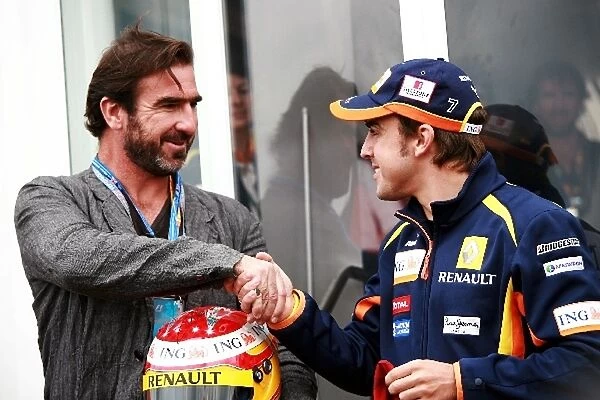 Formula One World Championship: Eric Cantona Football Player  /  Actor with Fernando Alonso Renault