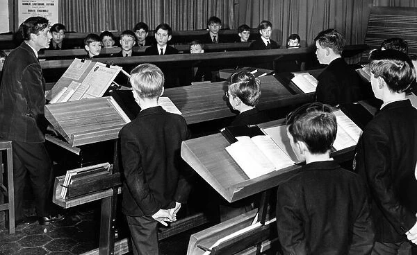 Boys of Coventry cathedral choir practice under Mr. David Lepine, the Cathedral organist