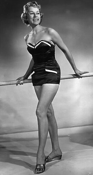 Model wearing latest swimsuit beachwear design 1955