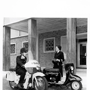 Two police officers with motorcycles, London