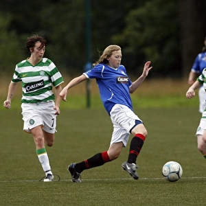 Determination on the Soccer Field: Lyndsey Holmes Tackles Lisa Swanson in Celtic vs Rangers Ladies Match at Lennoxtown, Glasgow