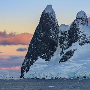 Antarctic Peninsula, Antarctica, Lemaire Channel. Una Peaks at sunset
