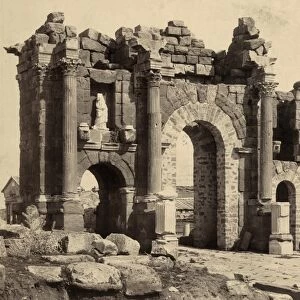 ALGERIA: ARCH OF TRAJAN. The triumphal Arch of Trajan in Timgad, Algeria. Photograph