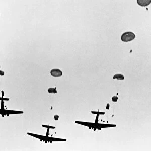 Parachutist jumping from American aircrafts during World War II