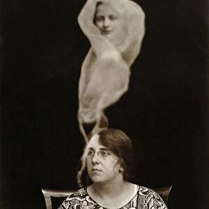 SPIRIT PHOTOGRAPH, 1921. Miss Evans with a spirit emanation. Photographed by English photographer Staveley Bulford, 1921