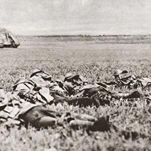 WORLD WAR I: BATTLEFIELD. American platoon of the 107th Infantry lying low behind