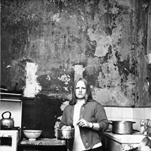 The Interior of slum housing in an area of Newcastle - Mrs Campbel in her kitchen where