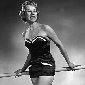Model wearing latest swimsuit beachwear design 1955